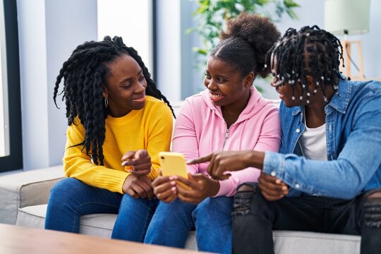 Friends sharing a connected moment around a phone